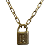 Gold chain with a padlock charm featuring a letter 'R' on a light gray background
