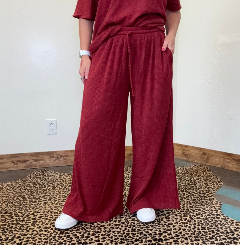 maroon outfit with wide-leg pants 