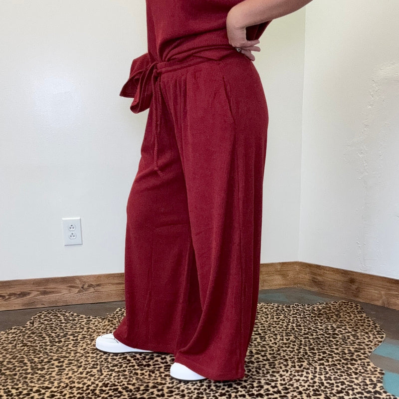 maroon outfit with wide-leg pants 