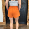 Person wearing orange skort 