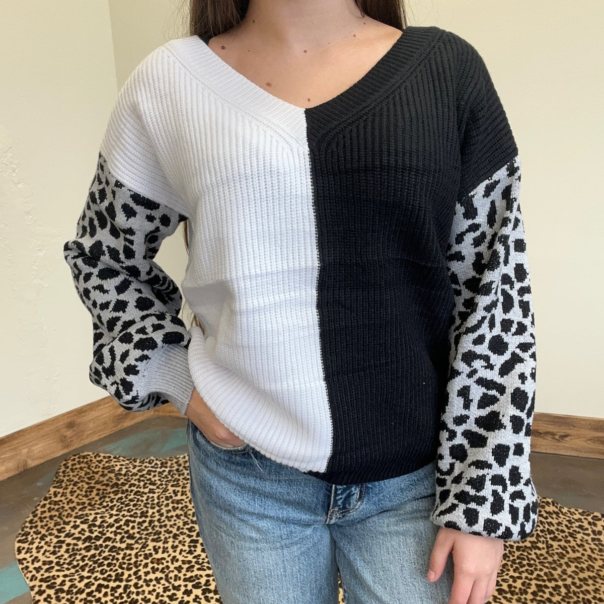 black and white sweater with leopard print sleeves 