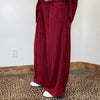 maroon outfit with wide-leg pants 