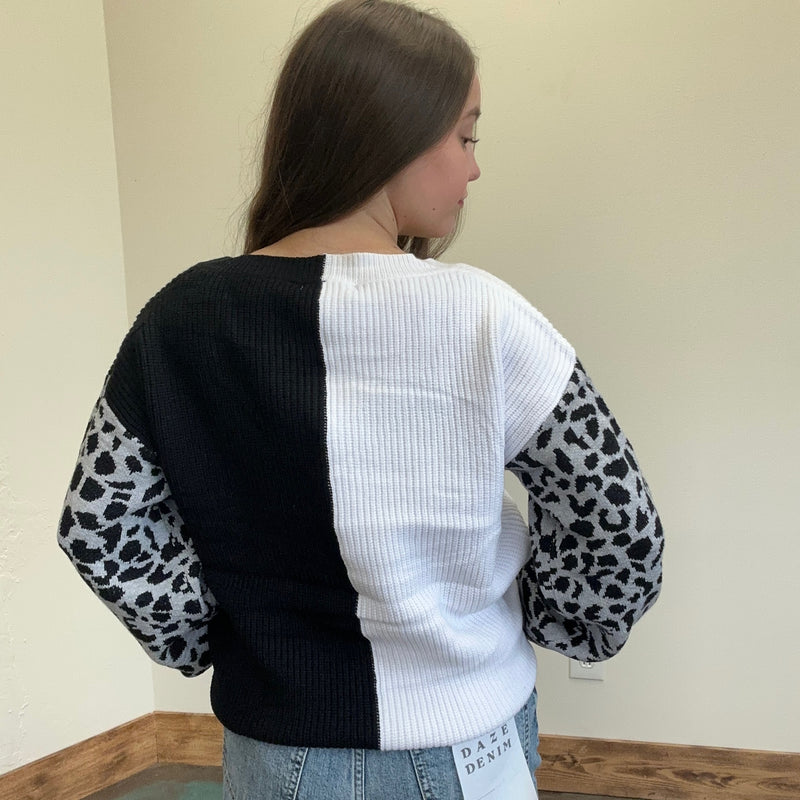 black and white sweater with leopard print sleeves 