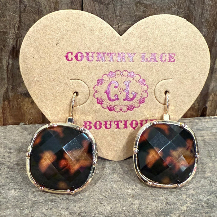 Tortoiseshell earrings on a heart-shaped card with 'Country Lace Boutique' branding.