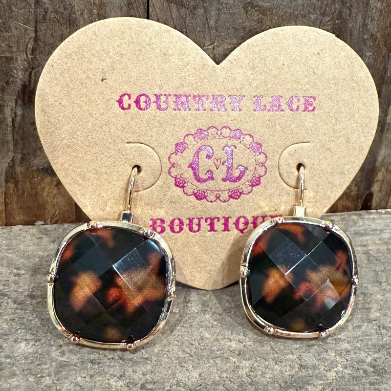 Tortoiseshell earrings on a heart-shaped card with 'Country Lace Boutique' branding.