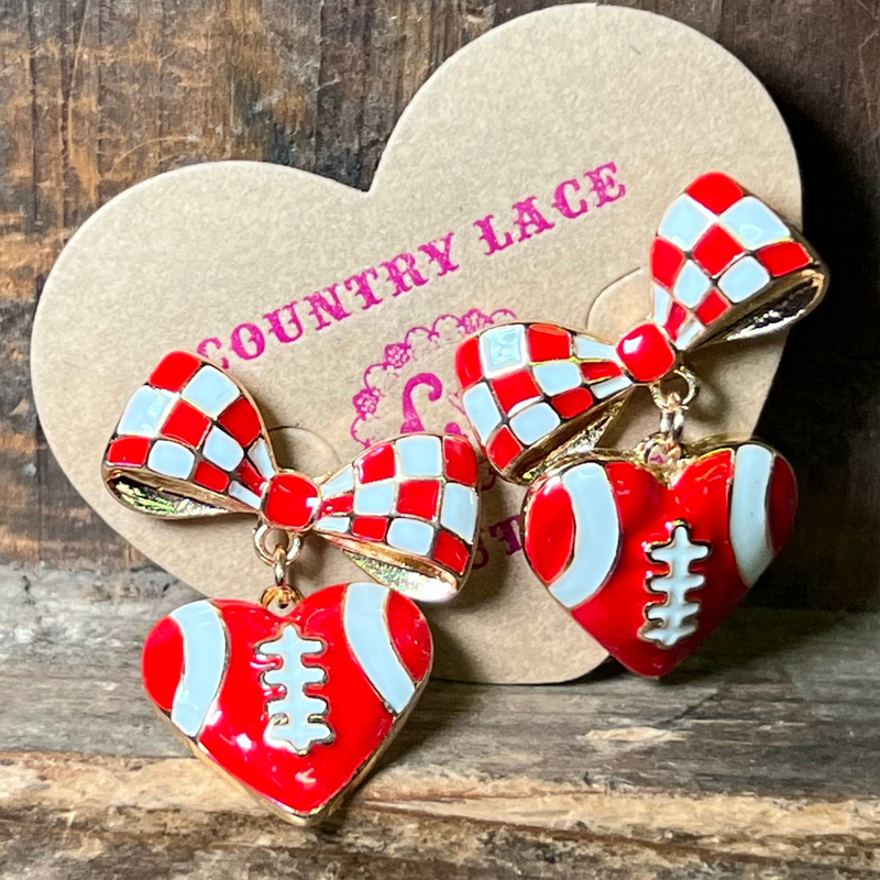 Red and white checkered bow and heart earrings on a Country Lace branded card.