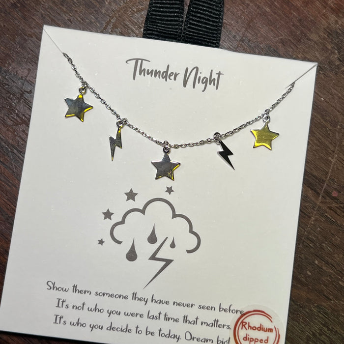 Necklace with stars and lightning bolts on a 'Thunder Night' card.