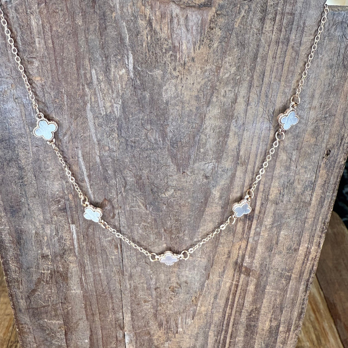 Gold necklace with clover-shaped pendants