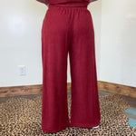 maroon outfit with wide-leg pants 