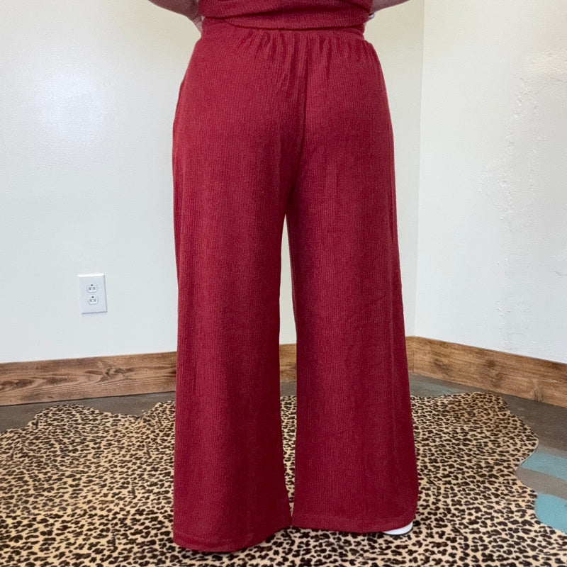 maroon outfit with wide-leg pants 