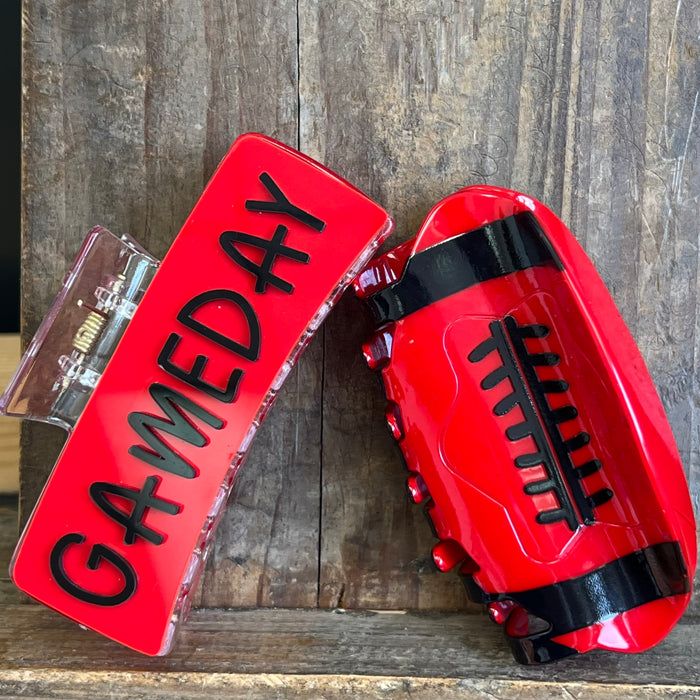 Red football-shaped container with 'GAMEDAY' text on a wooden background