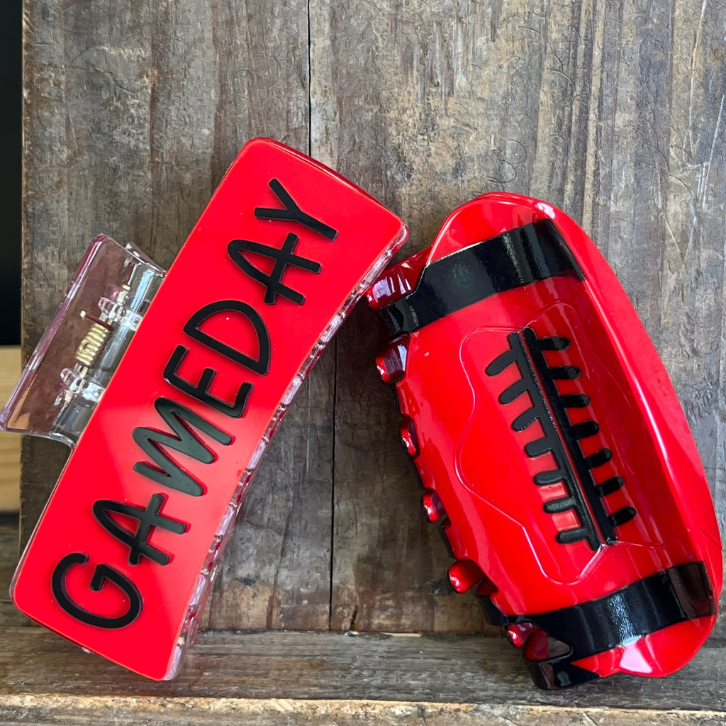 Red football-shaped container with 'GAMEDAY' text on a wooden background