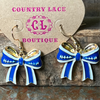 Blue and gold bow-shaped earrings on a Country Lace Boutique card.