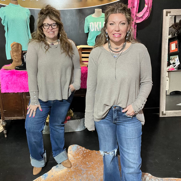 beige waffle longsleeve top with a wide neckline. 