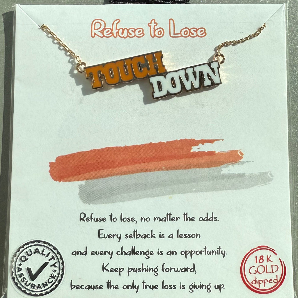 Necklace with 'Touchdown' pendant on a branded card with motivational quote.