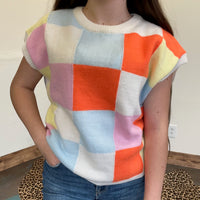 pink orange turquoise checkered sweater vest