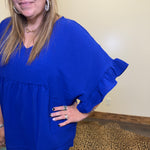 blue dress with ruffled sleeves