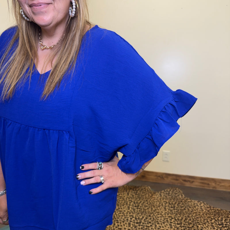 blue dress with ruffled sleeves