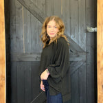 Woman standing in front of a wooden door