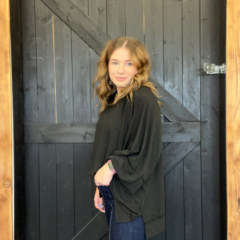 Woman standing in front of a wooden door
