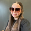 Person wearing large sunglasses 