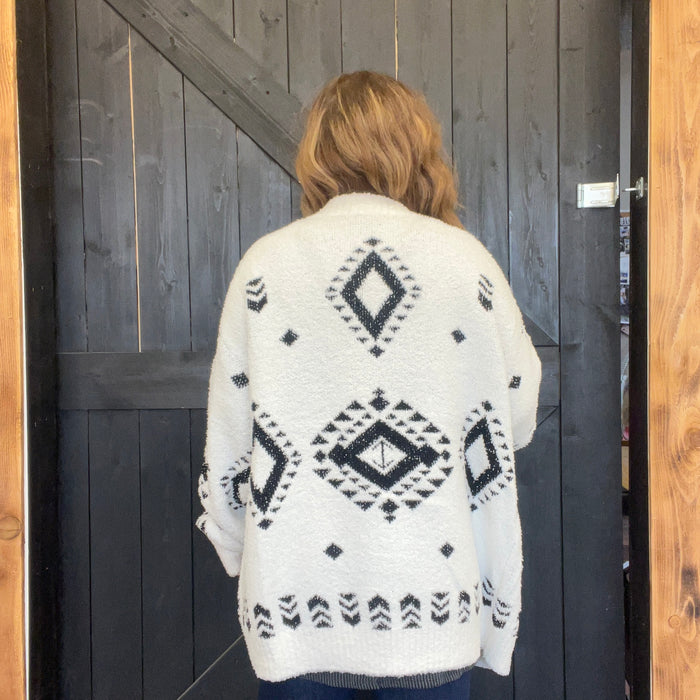 white sweater with black geometric 