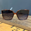 Sunglasses with tortoiseshell frame and dark lenses