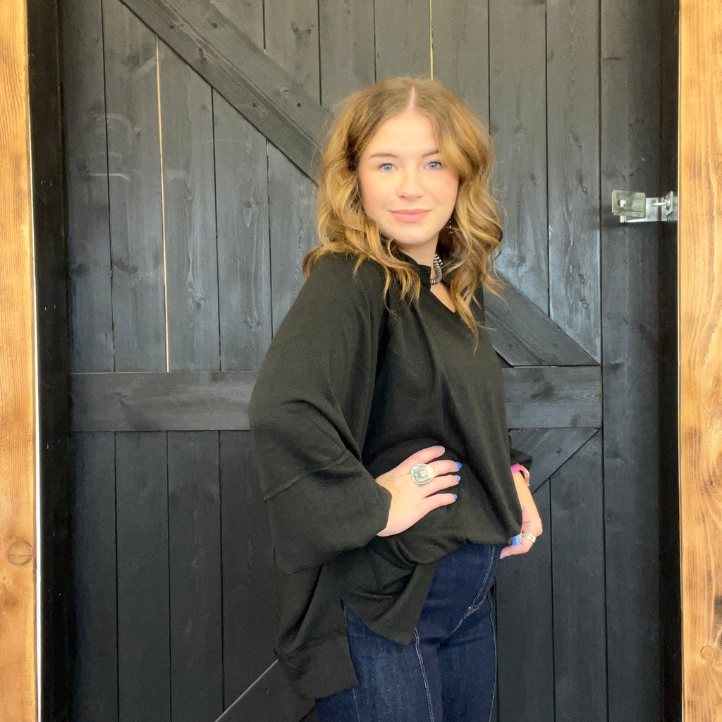 Woman standing in front of a wooden door
