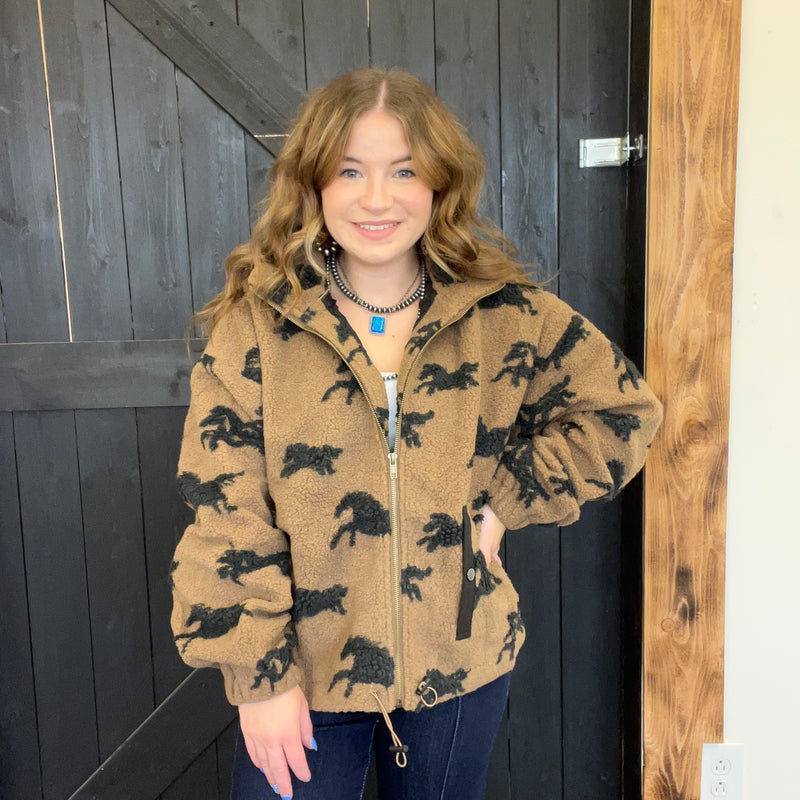  wearing a brown jacket with black horse