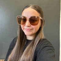 Person wearing large sunglasses with a 