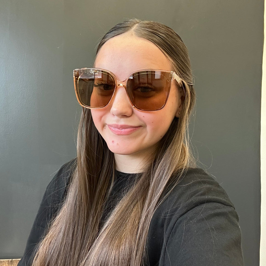 Person wearing large sunglasses with a 