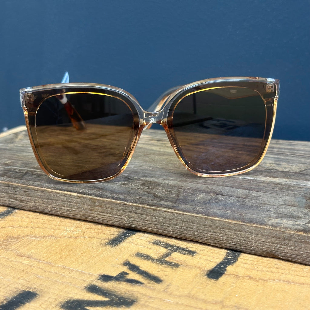 Sunglasses with gold frame and dark lenses