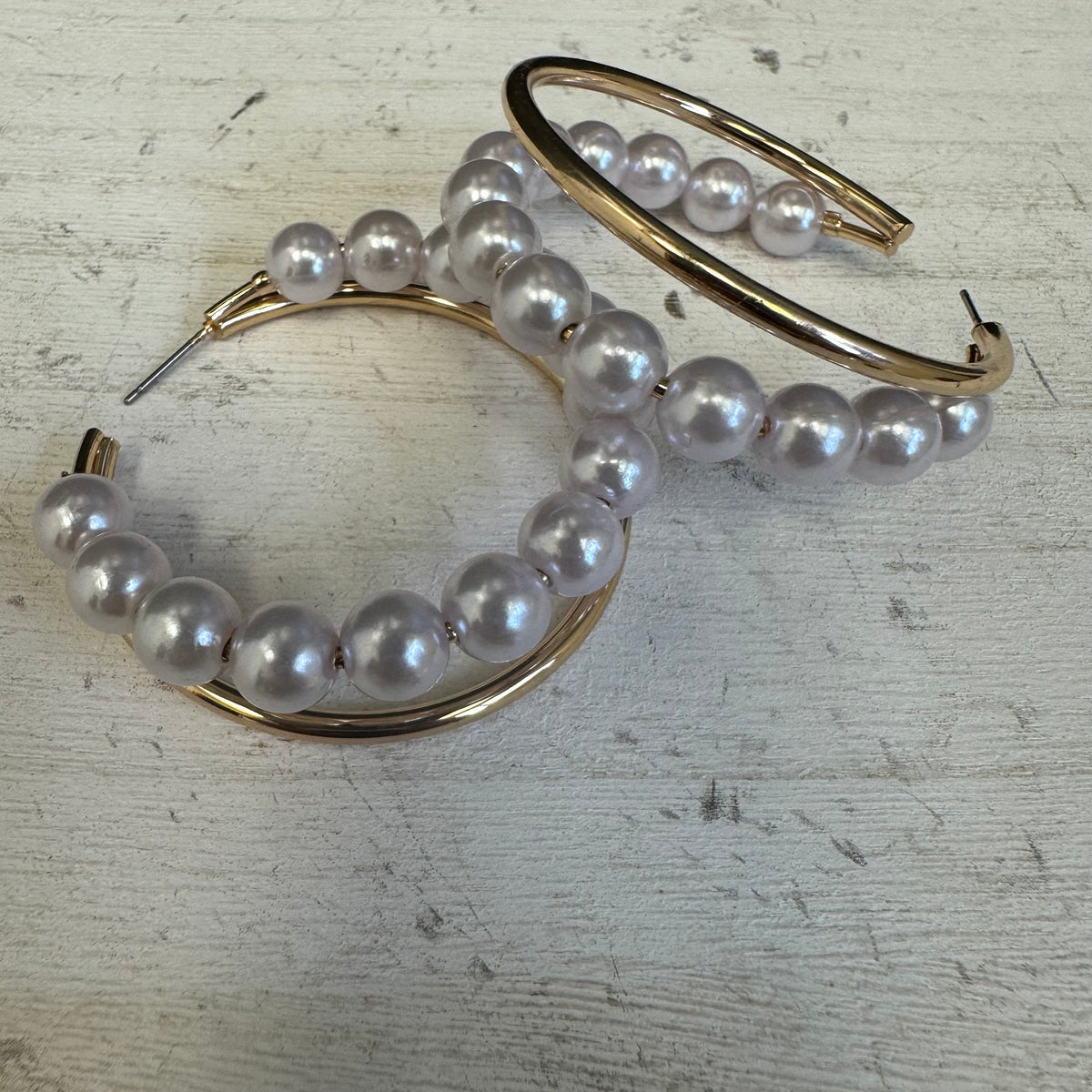 Gold hoop earrings with pearl beads