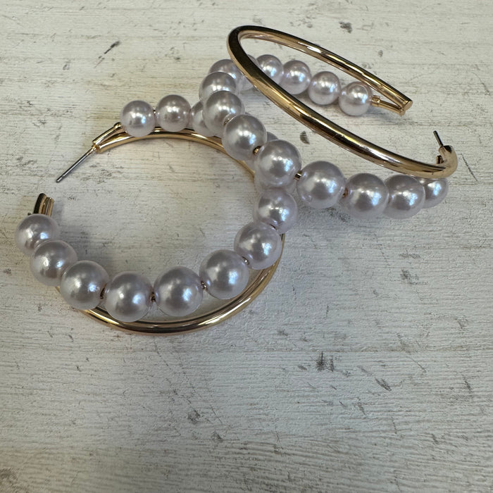 Gold hoop earrings with pearl beads