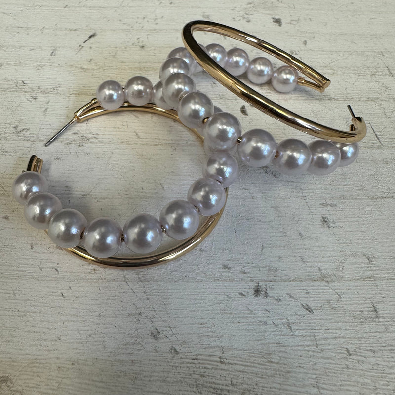 Gold hoop earrings with pearl beads