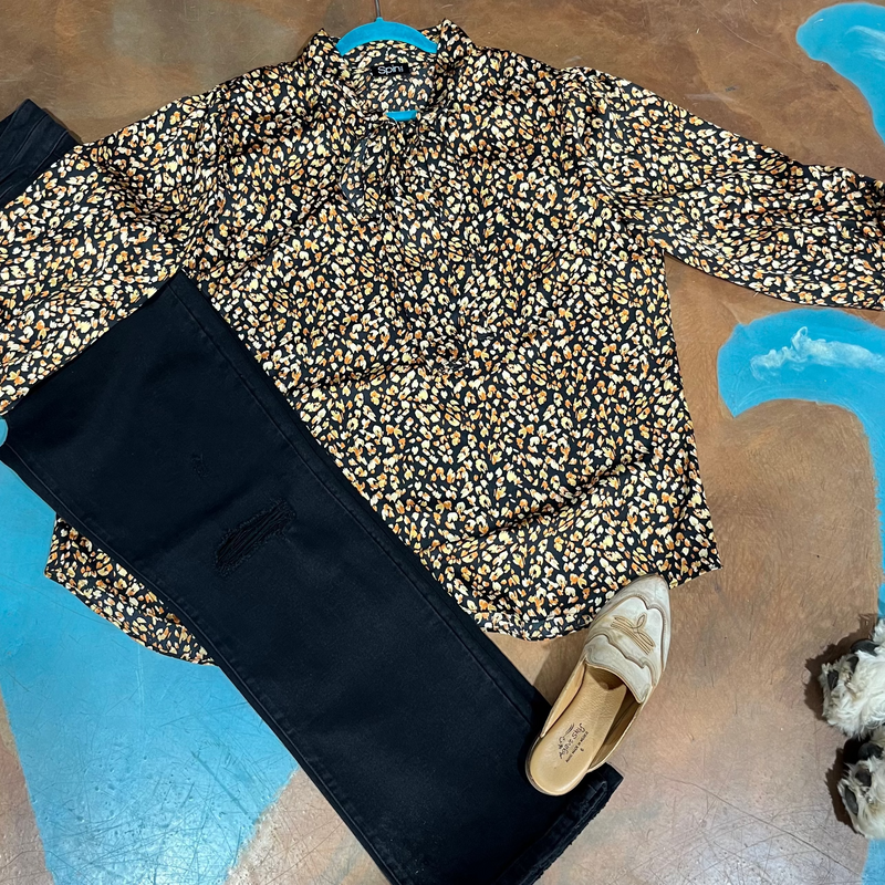 Leopard print blouse, black pants, and 