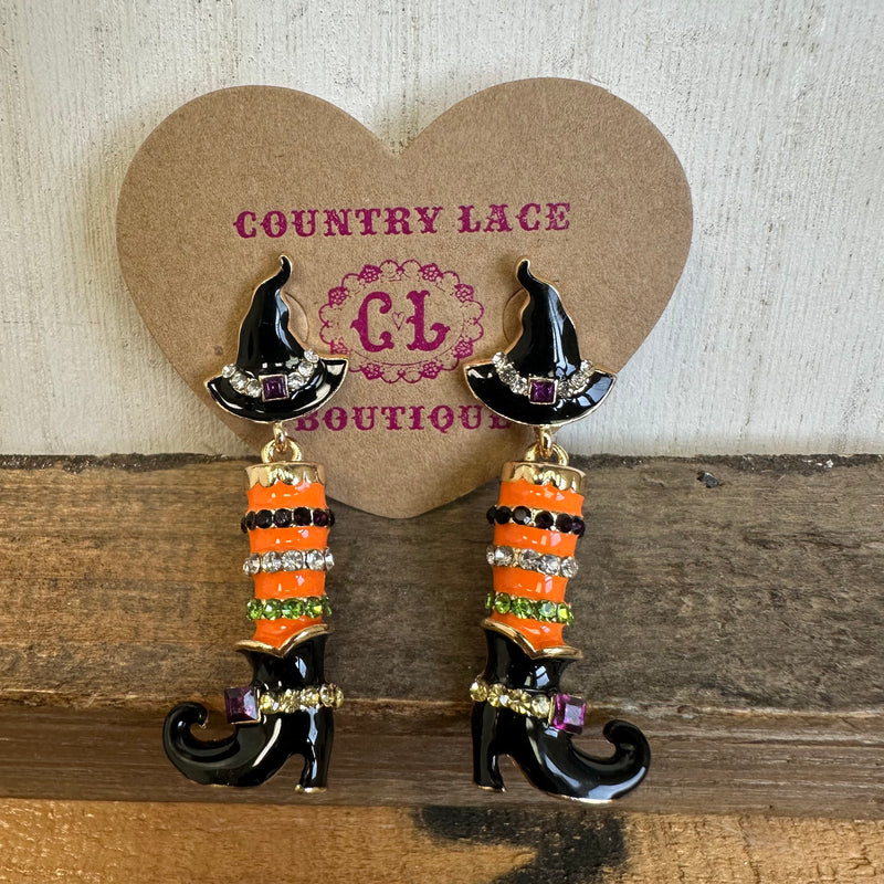 Witch boot earrings with black hats on a heart-shaped 'Country Lace Boutique' card.