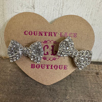 Pair of decorative silver bows