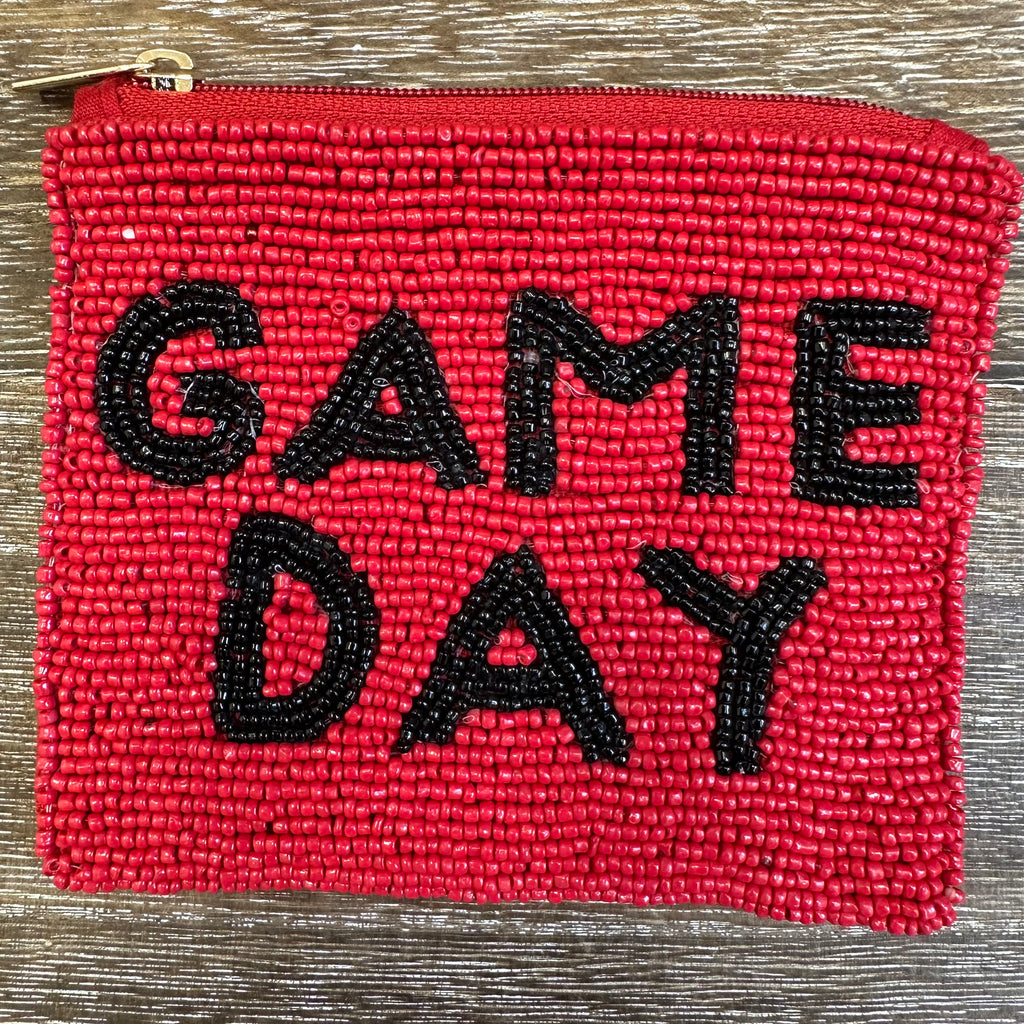 Red pouch with 'GAME DAY' text on a wooden surface