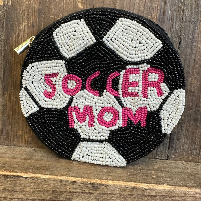 Round beaded purse with 'Soccer Mom' text on a wooden surface