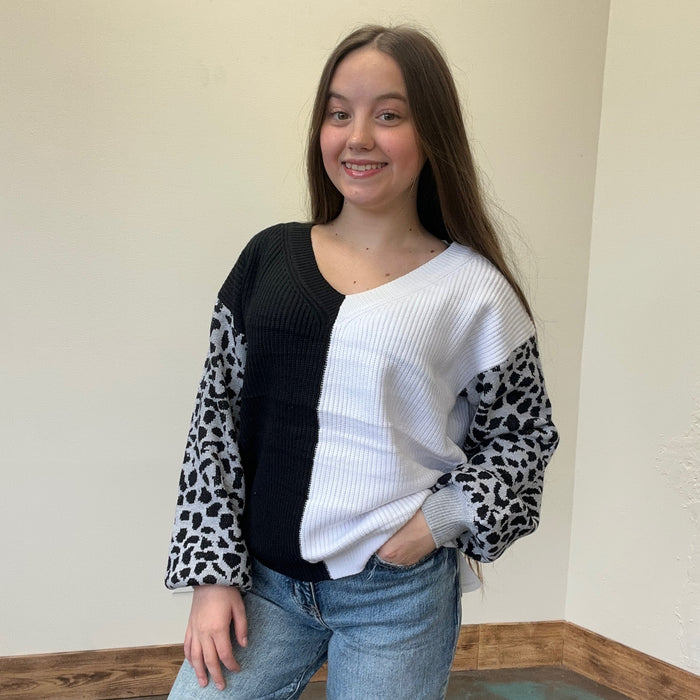 black and white sweater with leopard print sleeves 