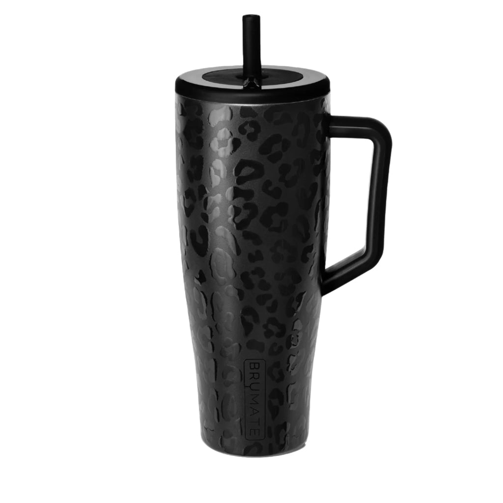Black leopard print mug with handle and straw on a white background