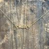 Gold necklace on a wooden surface