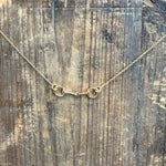 Gold necklace on a wooden surface