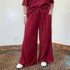 maroon outfit with wide-leg pants 
