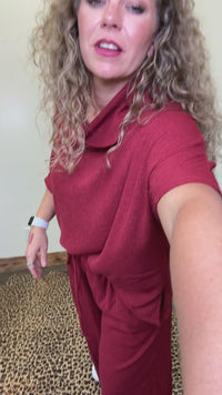 maroon outfit with wide-leg pants 