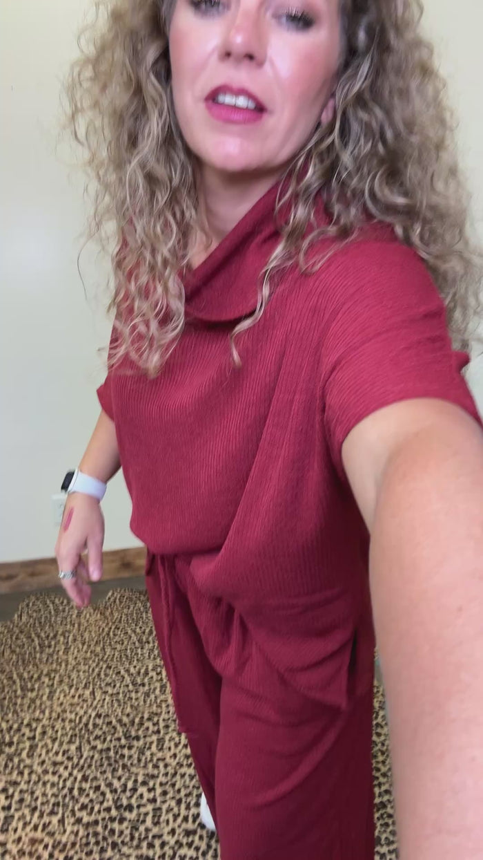 maroon outfit with wide-leg pants 