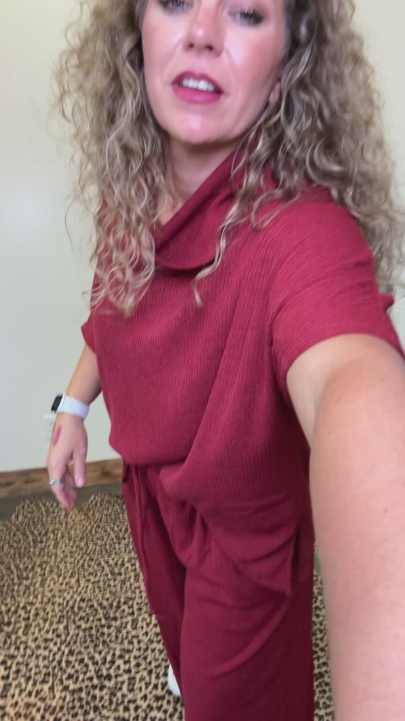 maroon outfit with wide-leg pants 